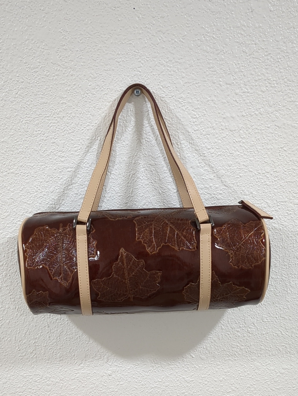 Glossy Brown Faux Patent Leather Leaf-Embossed Barrel Handbag with Cream Straps